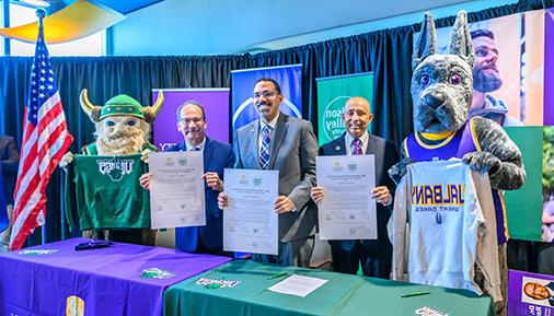 HVCC President Roger Ramsammy, SUNY Chancellor John King,University at Albany President Havid\u00E1n Rodr\u00EDguez pose with Damien the Great Dane and Victor the Viking mascots